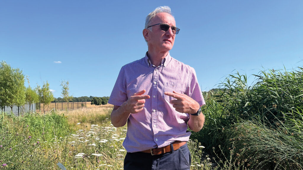 Farmer in a field with wildflowers
