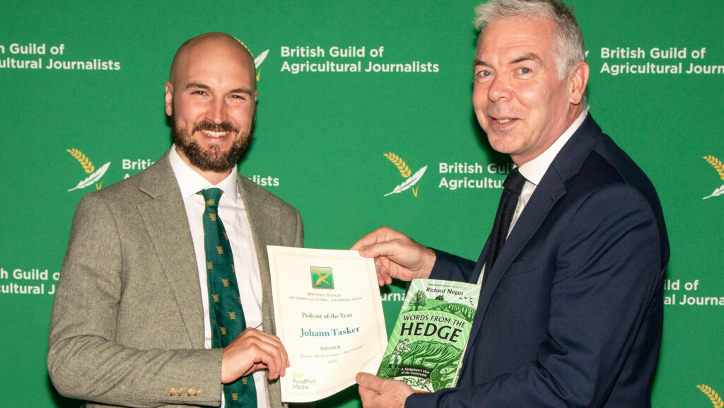Johann Tasker (right) collects his award from Ben Eagle