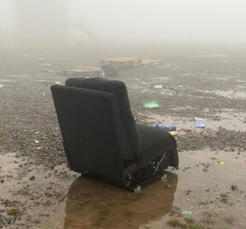 Armchair dumped in a field