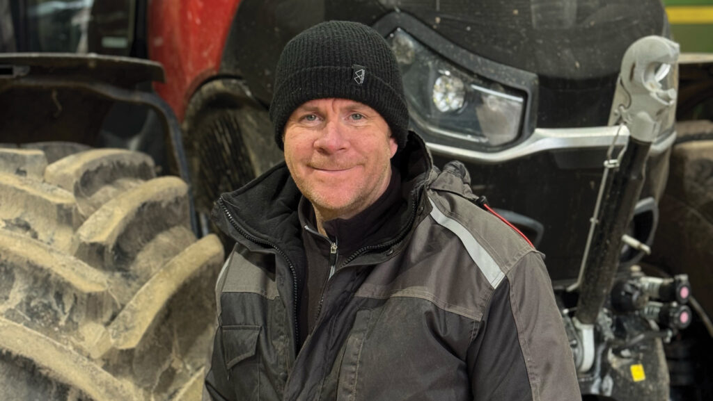 Farmer beside his tractor