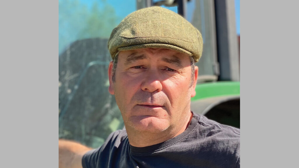 Farmer beside his tractor