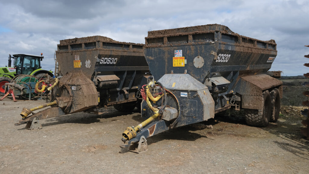 Muckspreader in a farmyard