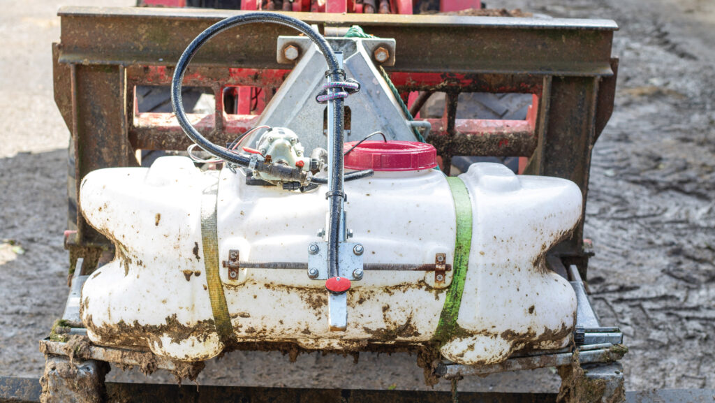 Sprayer mounted on scraper