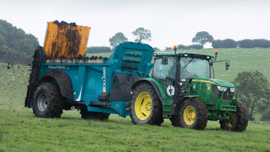 Tractor spreading farmyard manure