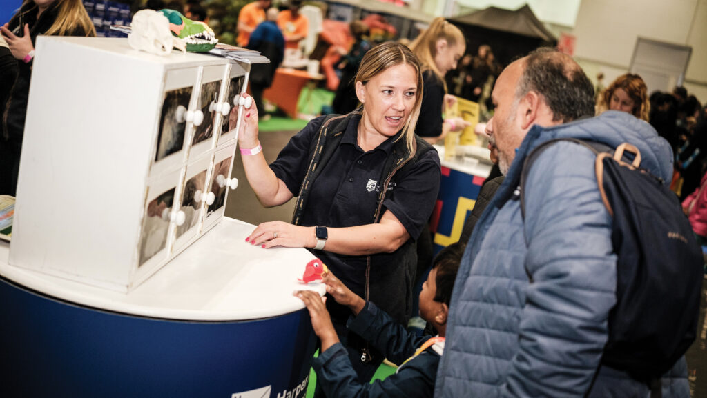 Stand with visitor at New Scientist Live 2024