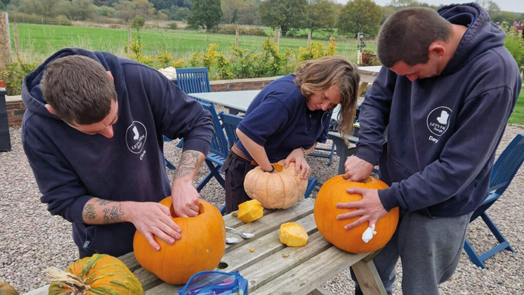 Rangers carving pumpkins on the farm © Let's Farm