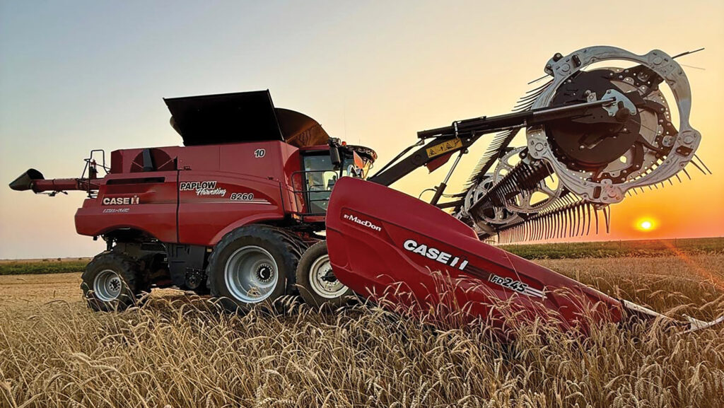 Case combine harvester in field