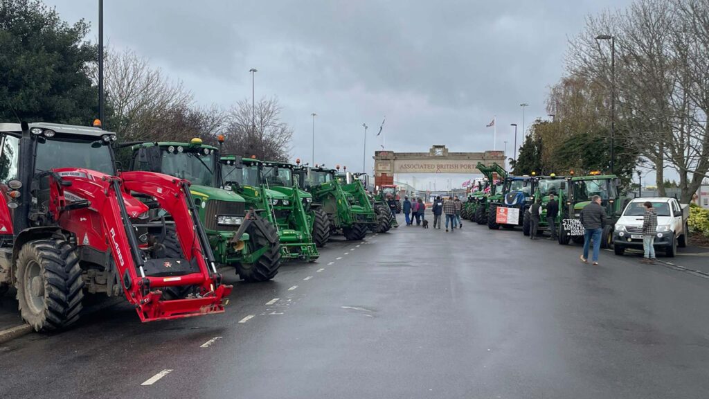 Tractors parked on  approach road to docks