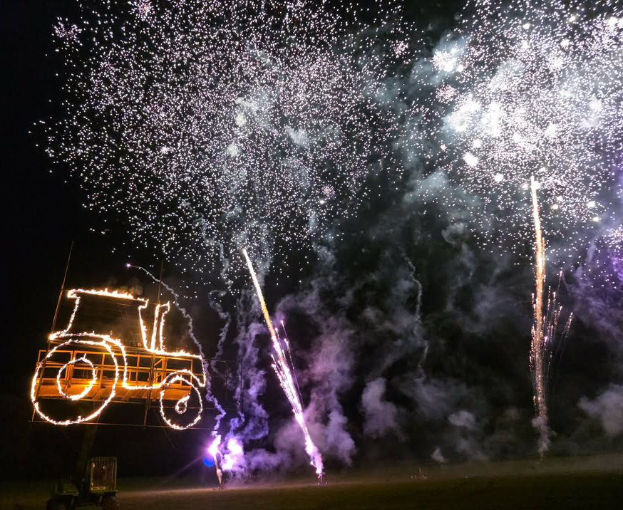 Firework display with tractor shaped display