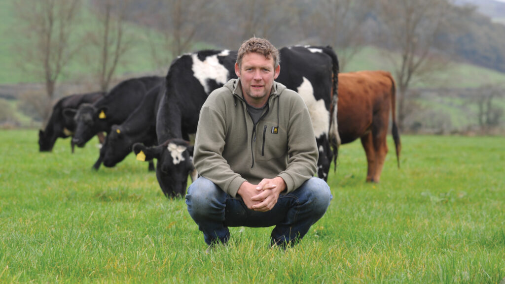 Wil Evans in pasture with herd