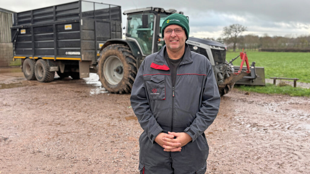 Farmer in front of tractor