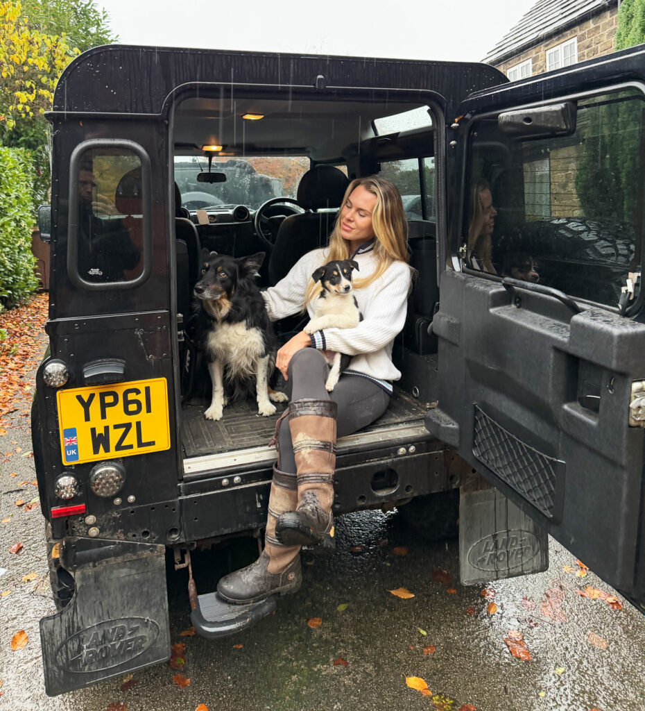 Dogs Charles and Albert with Emma-Jayne in the back of a Landrover