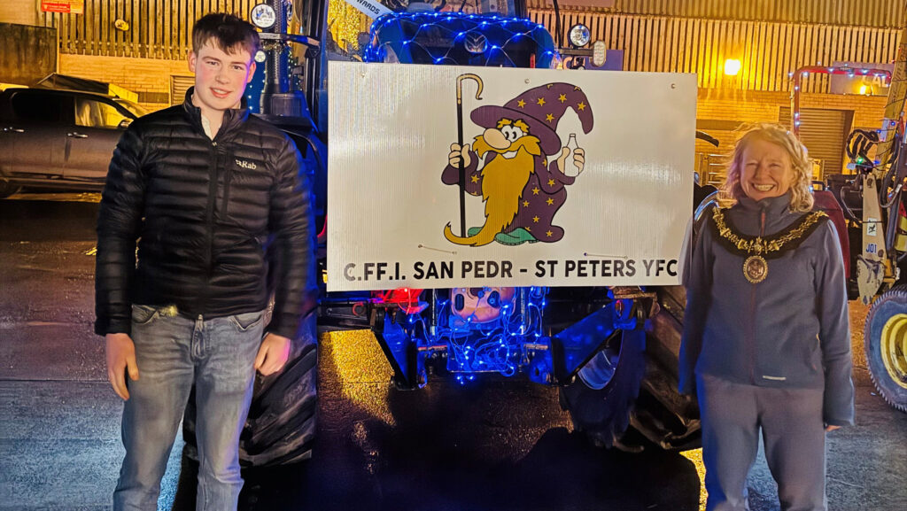 Young Farmers leader mayor by illuminated tractor