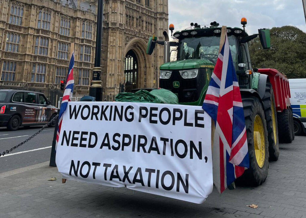 Working people need aspiration sign at Finance Bill tractor protest