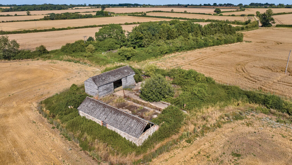 Drone view of derelict stone buildings