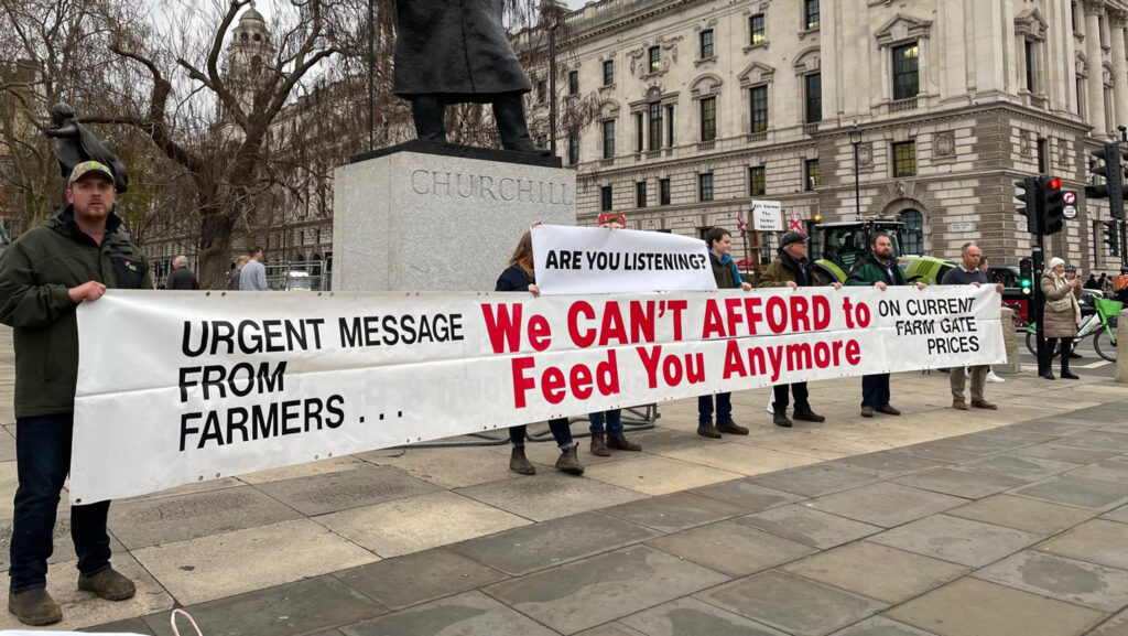 Sign by Winston Churchill statue at Finance Bill tractor protest