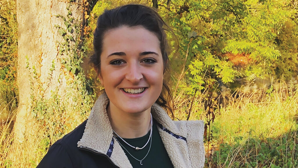 Portrait of woman standing outside