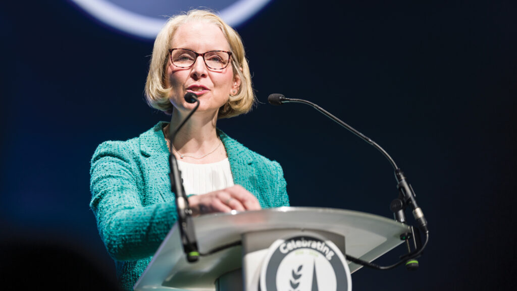 Woman addresses a conference
