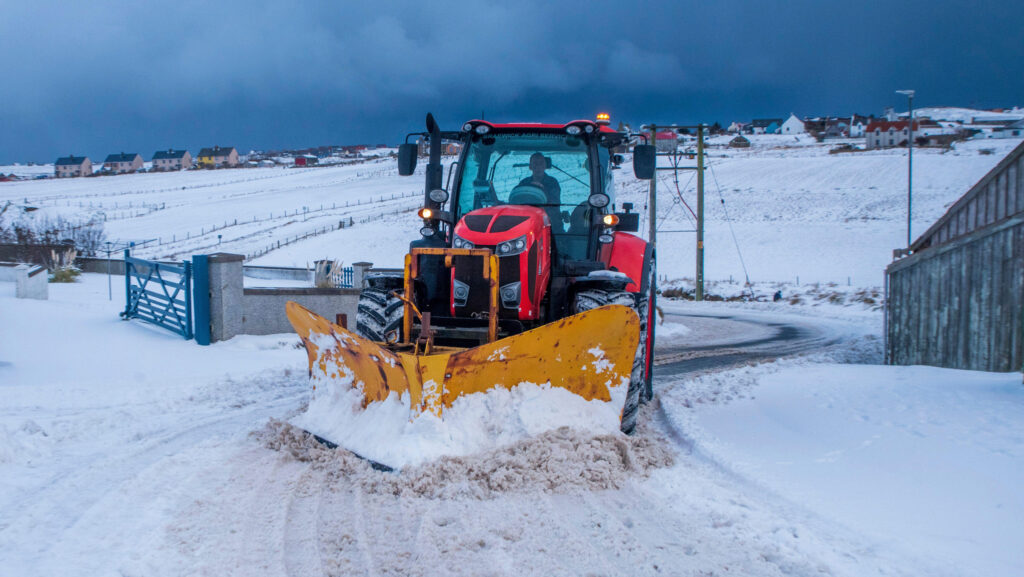 Farmer clearing snow from road  © Dave Donaldson/Alamy Stock Photo