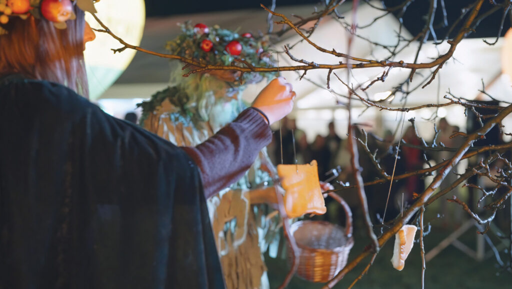 Hanging bread on the tree at Thatchers Wassail event