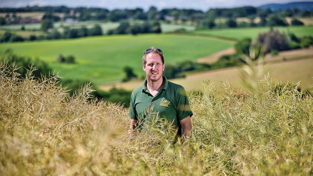 Farmer in a field of OSR