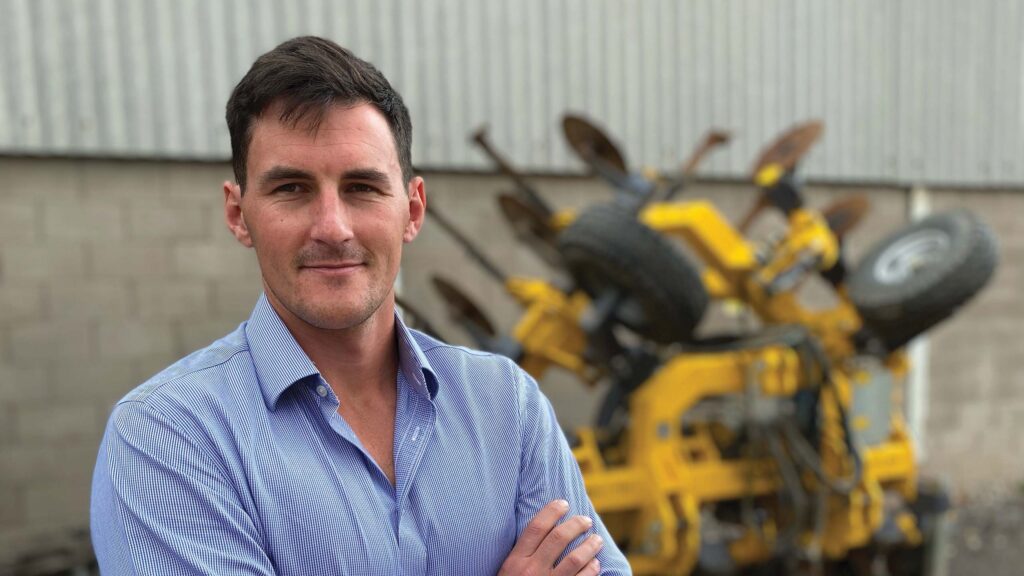 Man in a farmyard with machinery