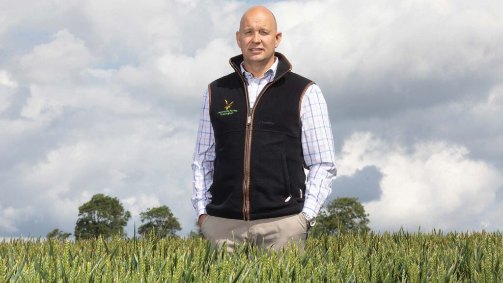 Farmer standing in a cereal crop