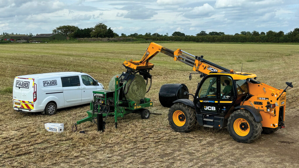 Wrapping round bales in film