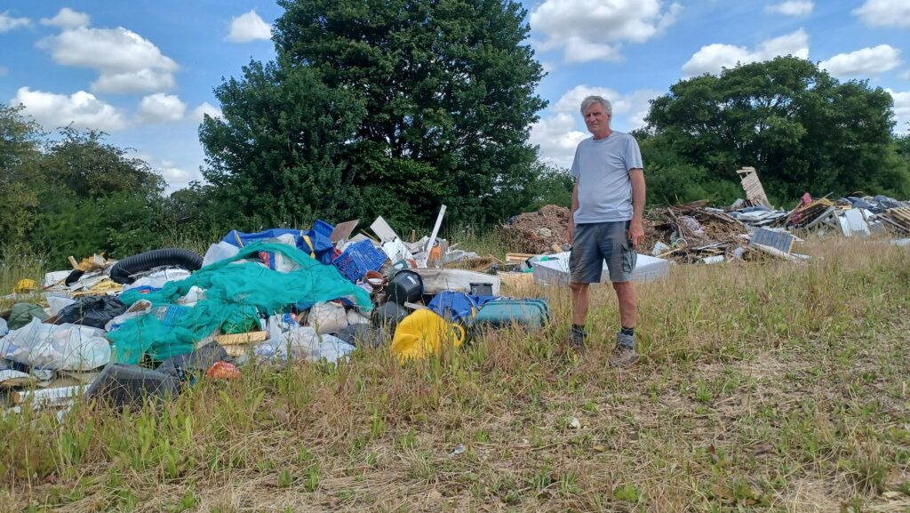 Will Dickinson with some of the fly-tipped waste
