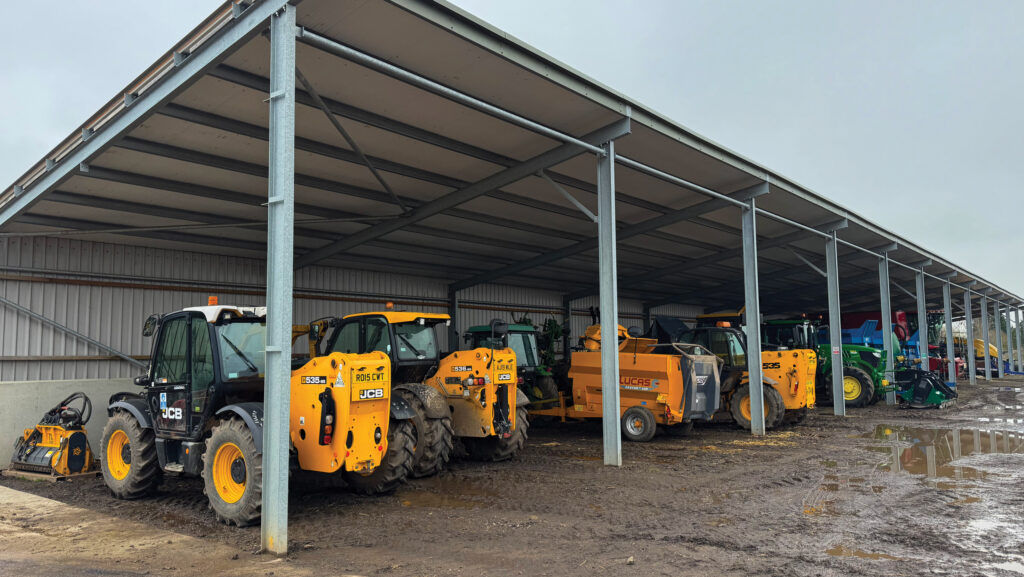 JCB telehandlers in a steel-framed shed