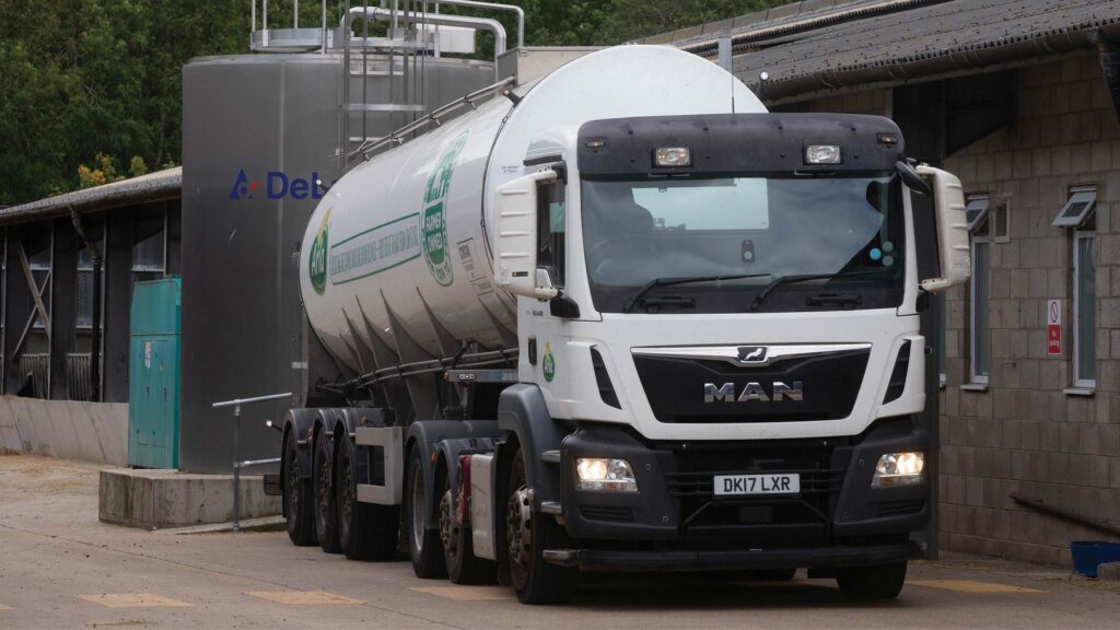 Milk tanker collecting milk from a farm