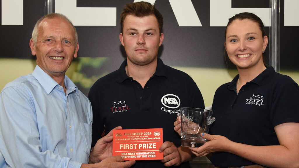 Tom Garlick (centre) collecting shepherding award