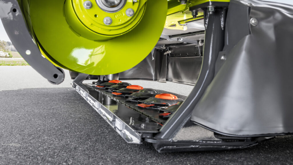 Close up of Claas Disco 1100 plain disc mower's direct swathing augers
