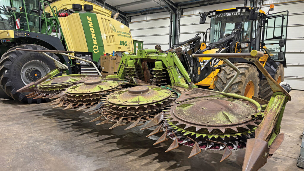 Harvester headers in a workshop