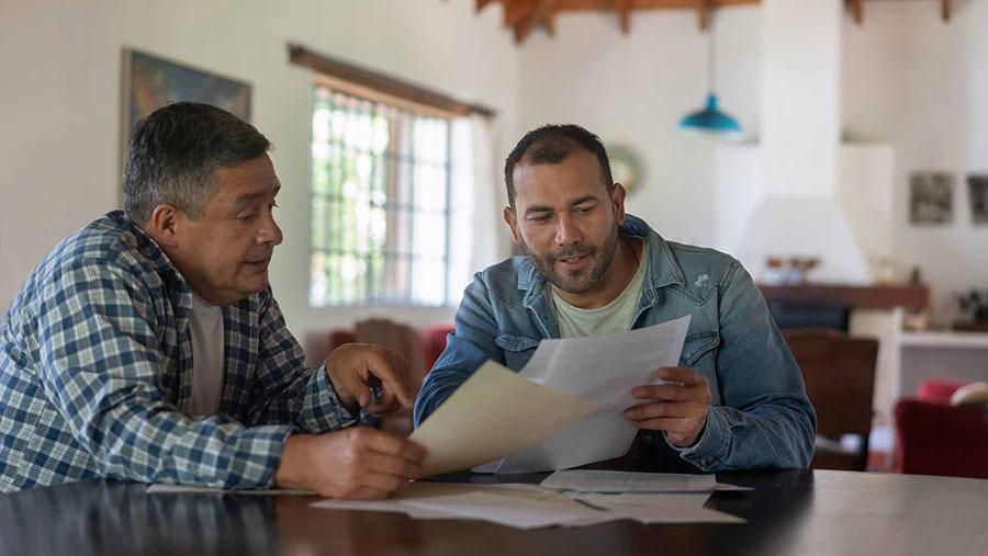 Farmer reviewing worker