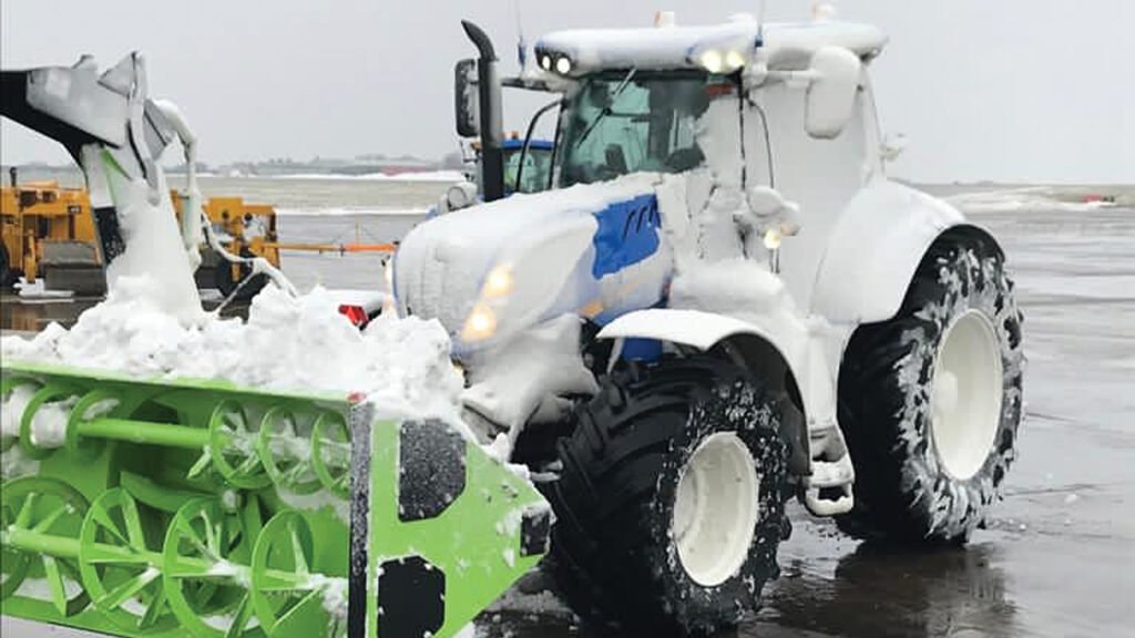 Tractor fitted with a snow plough