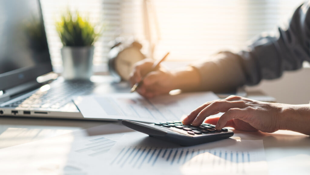 Person doing paperwork and calculating