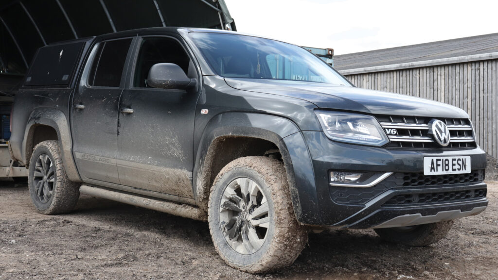 Pickup parked in farmyard