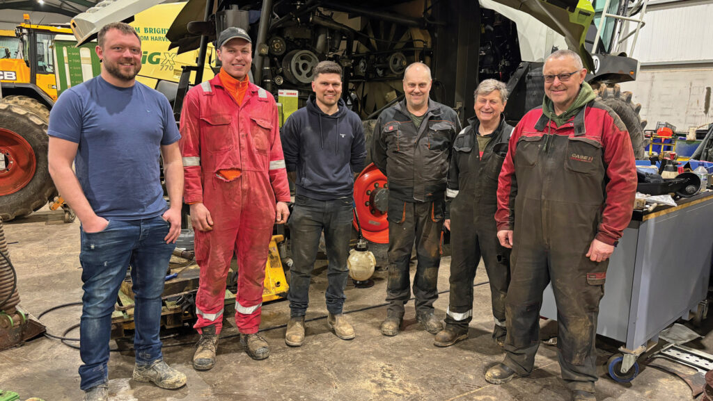 Row of men in overalls