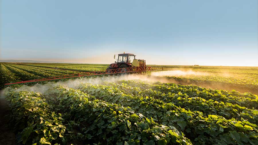 Sprayer in arable field