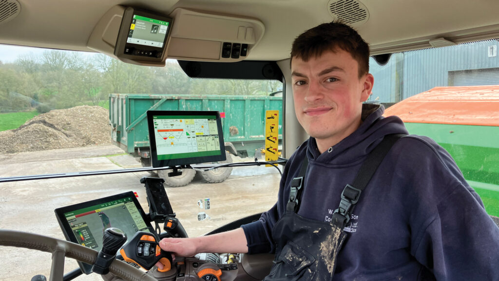Young farmer in a tractor seat