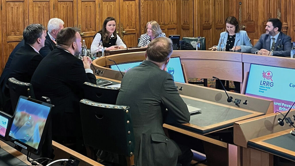 People sit around a conference table