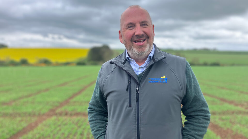 Man in a crop trial field