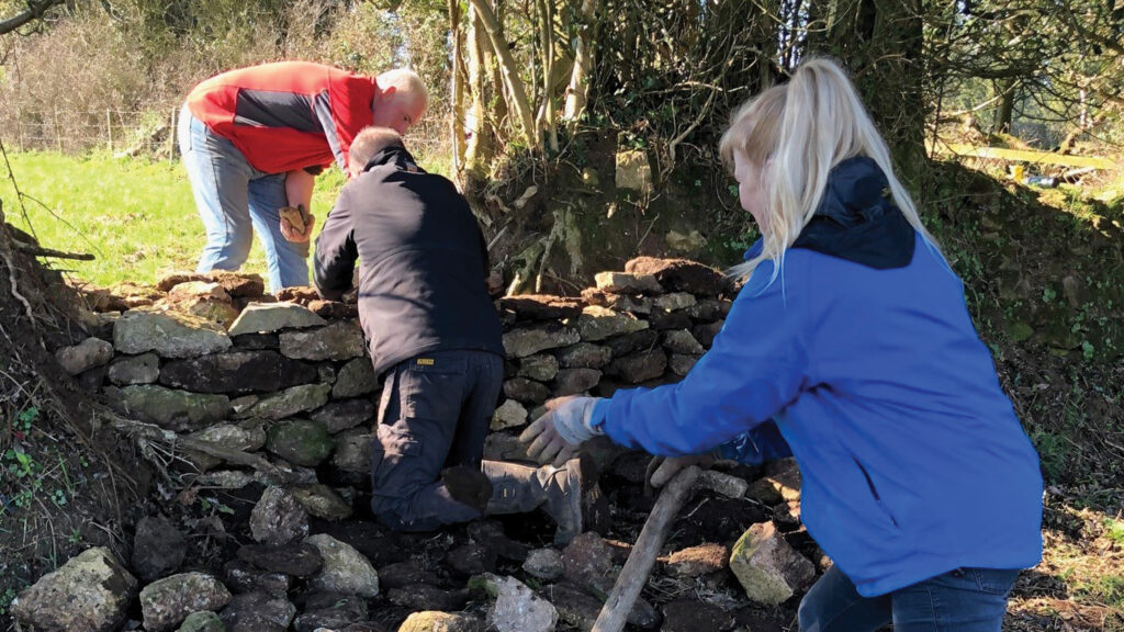 Workers dry stone walling