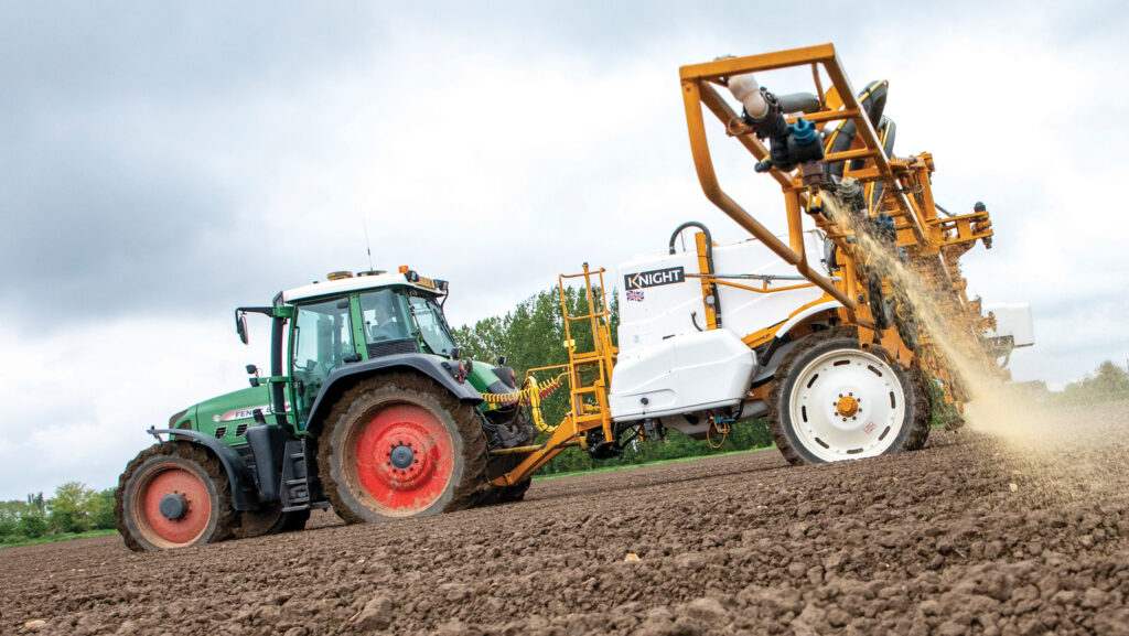 Sprayer in a crop of potatoes