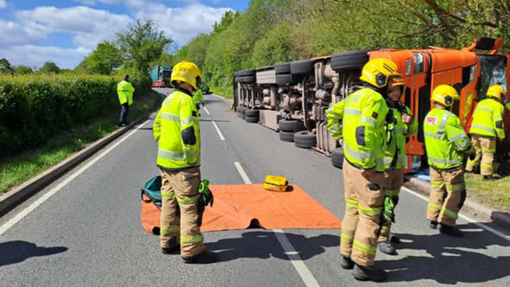 Sheep transporter on its side after crash