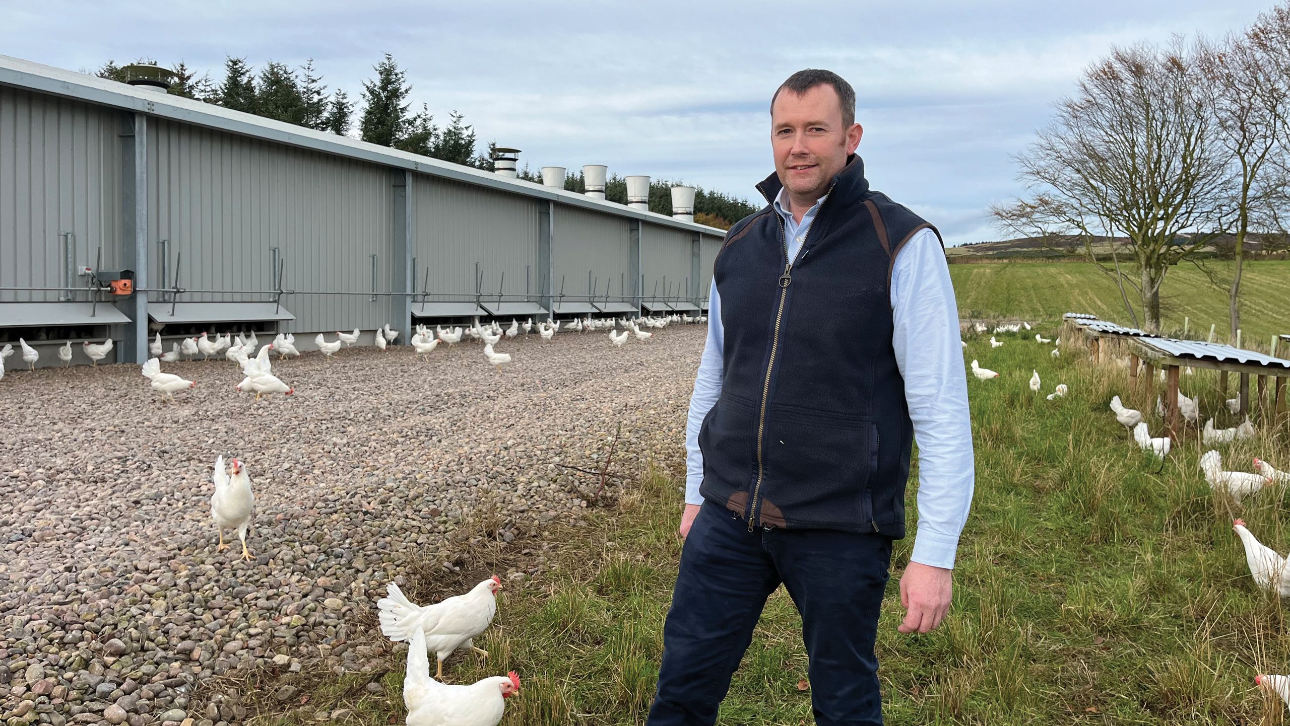 Iain Chapman with hens on farm