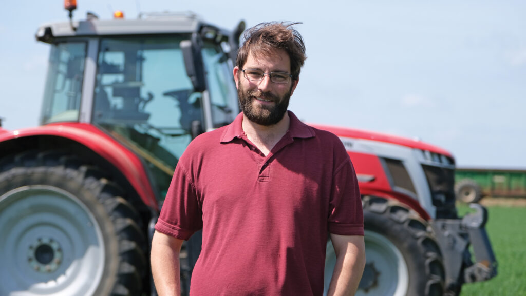 Farmer in front of a tractor