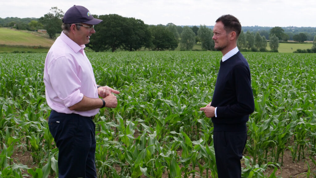 Tom Bradshaw and Stephen Morgan talking in a field on Tom's farm