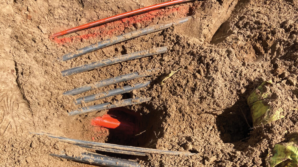 Marked cables being dug up